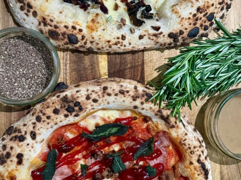Pizza Cult at the Barras Market have pigs in blankets and chestnut roaster specials for Christmas