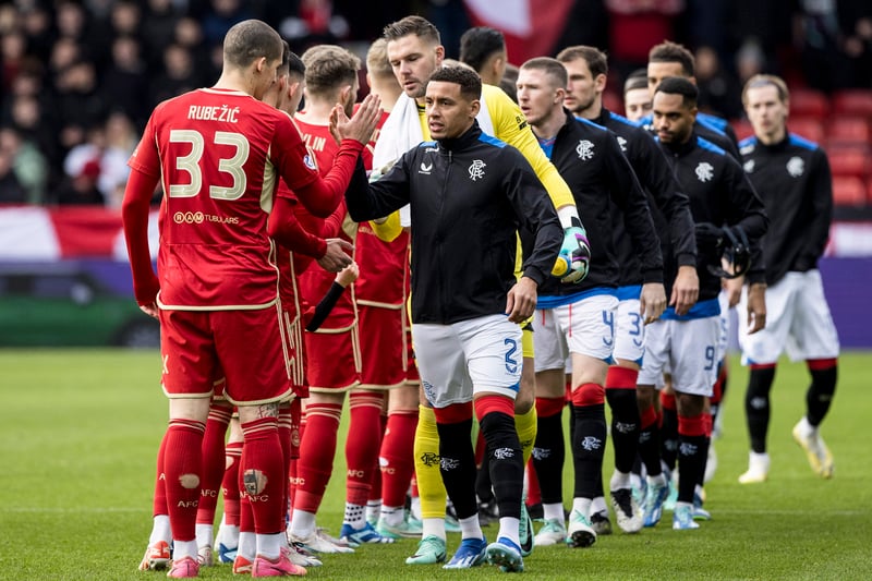 Both teams shake hands at Pittodrie ahead of a Scottish Premiership clash last month.