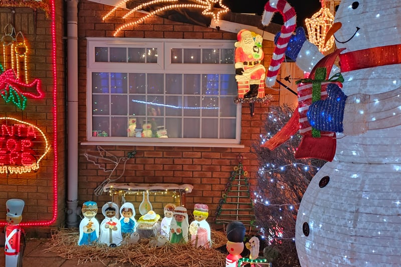 The Nativity scene is made up of illuminated figurines.
