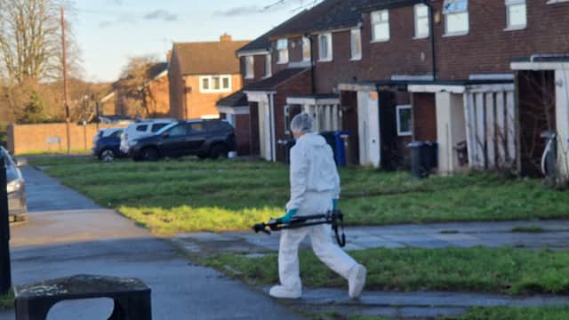A crime scene investigator walking to a police van near Ironside Walk. Officers have been at the scene since 1.30pm on December 15.