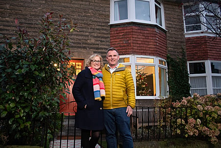 Scotland's Christmas Home of the Year winners Katie and Jamie outside their festive home.