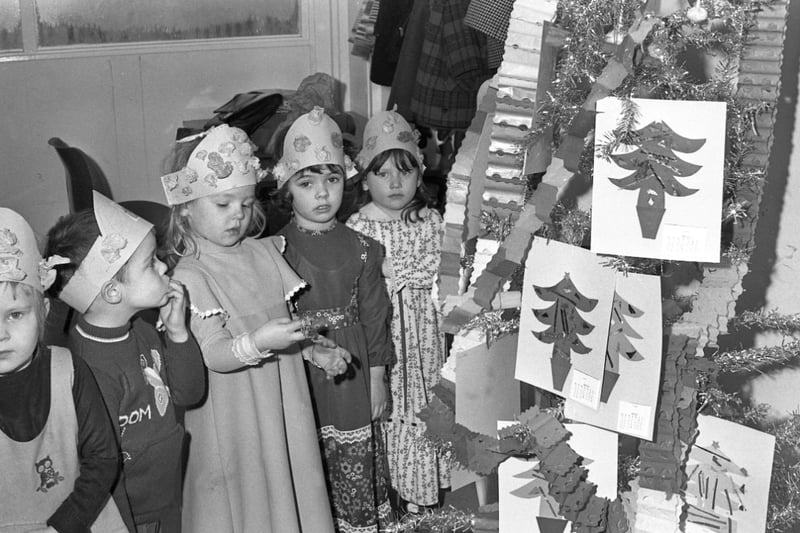 Gathering around the Christmas tree at Castletown Community Centre in this festive 1977 scene.