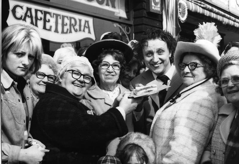 A large crowd of fans and a large jam butty greeted comedian Ken Dodd when he arrived in Blackpool in March 1974. Ken was here for the official opening of a new cafe, the Chuck Wagon in Deansgate, owned by Gerard Naprous and his partner Tina
