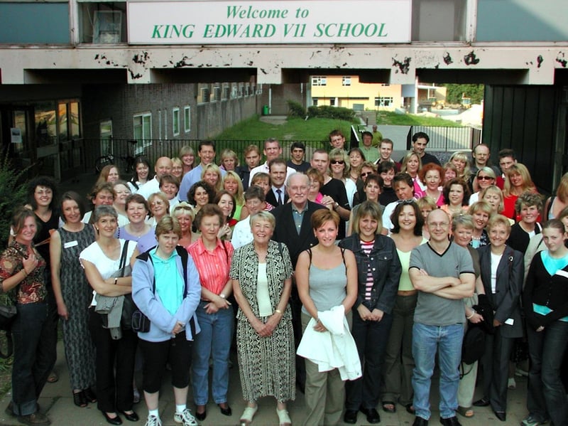 The final reunion at King Edward VII School,
Crosspool. Former pupils are pictured outside the old school entrance, with the new building in the background, with former headteacher Russell Sharrock in the centre, in 2001.