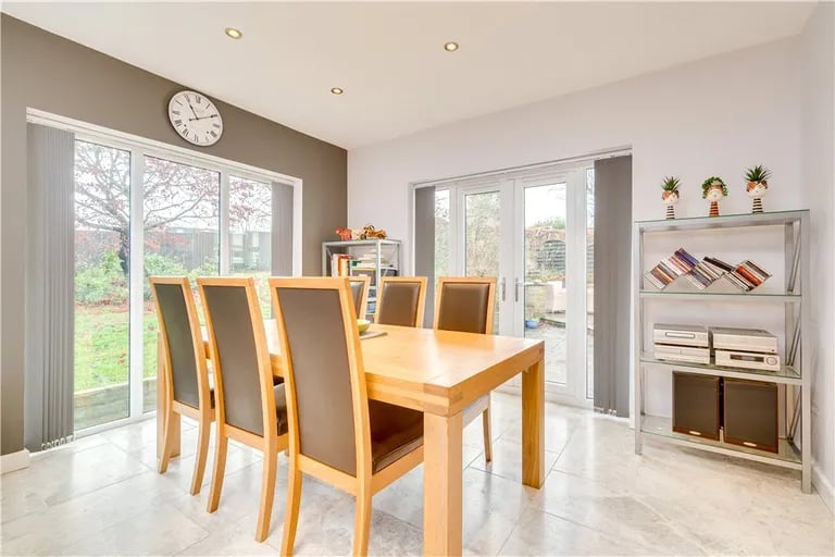 It leads into a large dining area with access to the rear garden.
