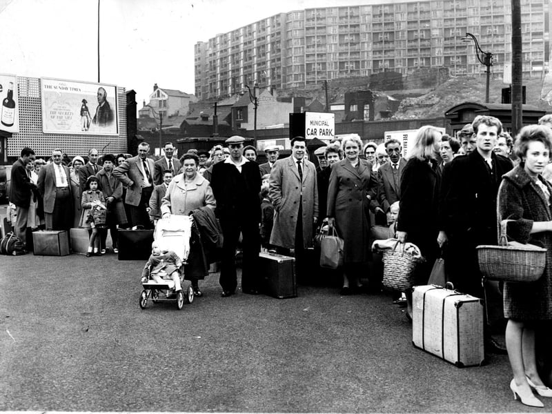 Holidaymakers queue to catch their seaside-bound coaches from Sheffield's Pond Street Bus Station on a bank holiday weekend in 1962