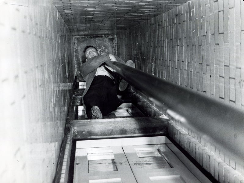Sliding down the fireman's pole at Sheffield Central fire station in October 1962