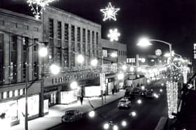 Christmas illuminations on The Moor, Sheffield, in November 1962, with the shops pictured including British Home Stores