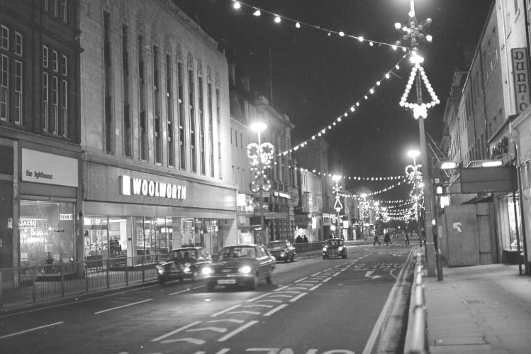 Woolworths shines under the Christmas illuminations in Fawcett Street in December 1974.