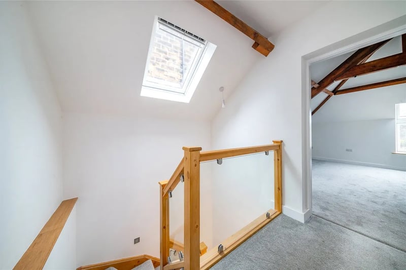 The stairs in the hall takes you to this bright landing with Velux rooflight.