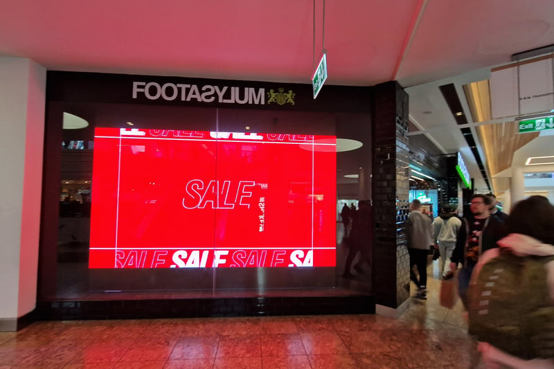 Trainer shop Footasylum has huge flashing screens advertising its sale.
