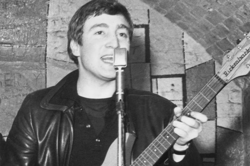 Singer, guitarist and songwriter John Lennon performs at the Cavern Club before going on to achieve global super-stardom with The Beatles.