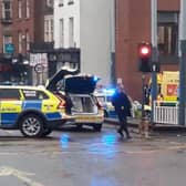 A crash involving a police car and a black taxi is causing significant disruption in Sheffield city centre.