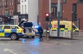 A crash involving a police car and a black taxi is causing significant disruption in Sheffield city centre.