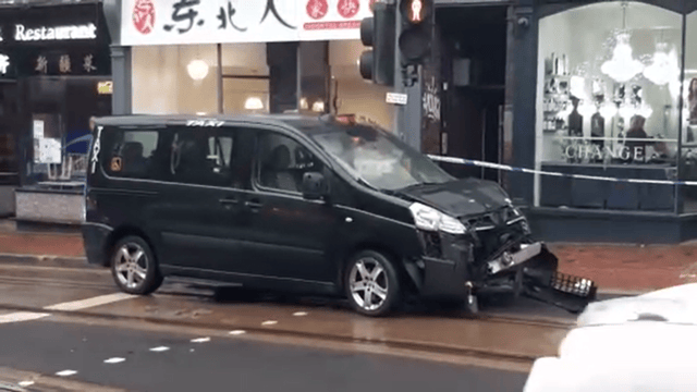 A black taxi involved in the accident took significant damage.