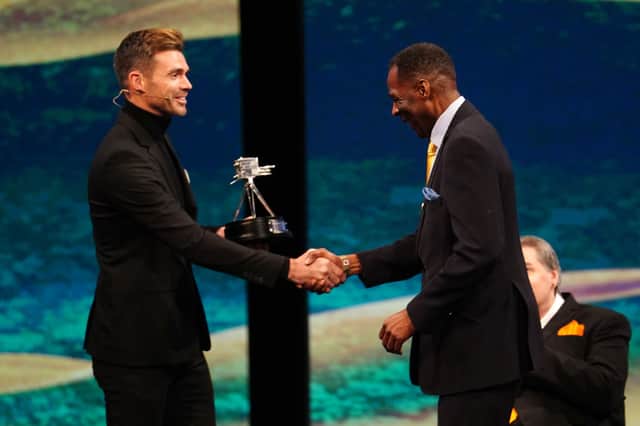Sheffield Caribbean Sports Club founder Des Smith receives his BBC Sports Personality of the Year Unsung Hero award from England cricketer James Anderson