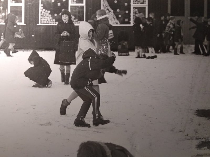 Youngsters at Baines Primary School in Thornton made the best use of overnight snowfall before going into the classroom, December 1981