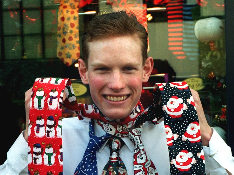 Mark Smith wears some of the Christmas ties at Tie Rack in Blackpool
