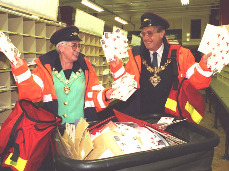 Helping out as Posties for the Christmas rush, the Mayor of Blackpool - Councillor Les Kersh and the Deputy Mayor of Blackpool - Councillor Sue Wright, during their visit to the Royal Mail sorting office at Edward Street