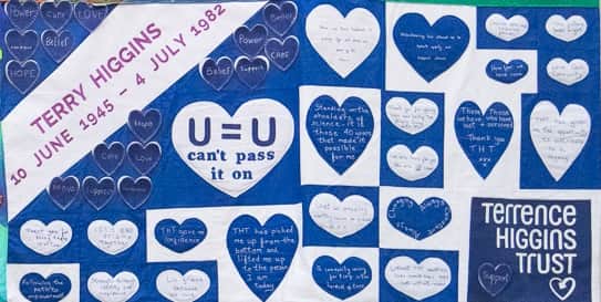 One panel of the quilt reading 'U=U', meaning 'undetectable equals untransmittable'. 