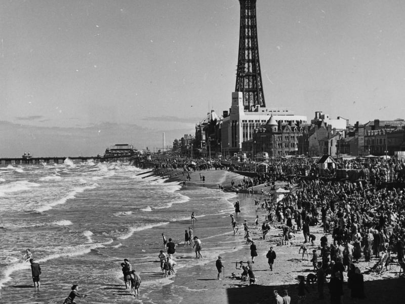 circa 1955:  Crowds of day-trippers on the beach at Blackpool, Lancashire.  Blackpool Tower is in the background.  (Photo by Evans/Three Lions/Getty Images)