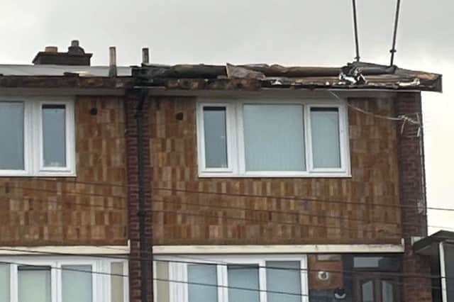 Previous damage to the roof of the maisonettes on Haslam Crescent, in Lowedges, Sheffield, during Storm Pia in December 2023