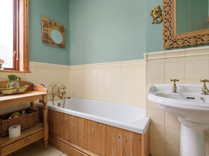 Two bedrooms and this bathroom are found on the first floor. (Photo courtesy of Zoopla)