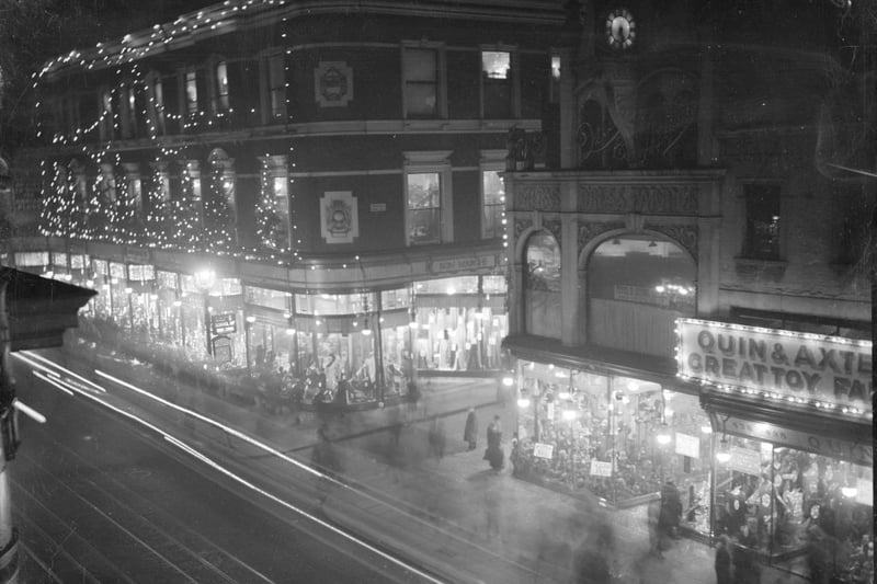 December 1927:  An array of Christmas lights brightening department stores Bon Marche and Quin and Axtens on Brixton Road, London.  (Photo by General Photographic Agency/Getty Images)