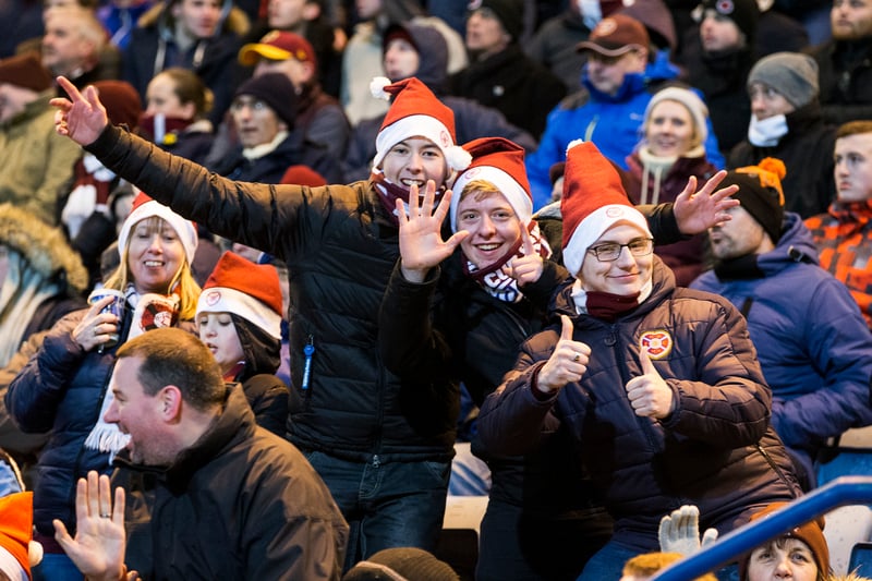 Hearts fans feel the festivities and find the camera.