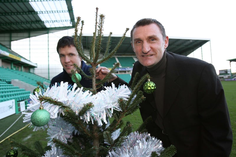 Former Hibs star Gary Caldwell and manager Tony Mowbray embrace the Christmas spirit in 2005.