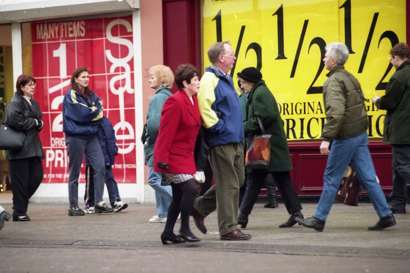 Shoppers on the streets in 1998 with bargains at half price.