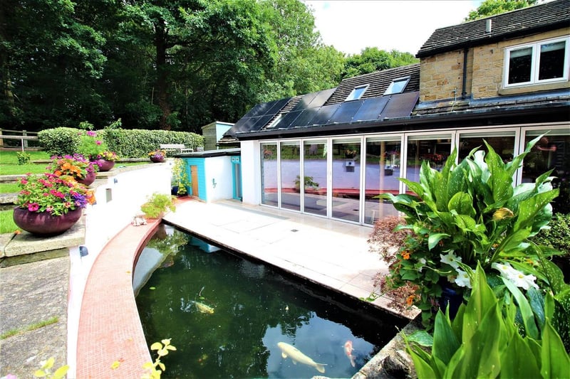 The 19th century cottage has a large patio area, maintained lawns, and a peaceful koi pond. Photo courtesy of Zoopla 
