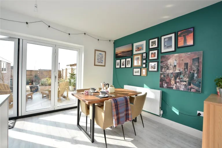 Here is also a spacious dining area with French doors to the rear garden.