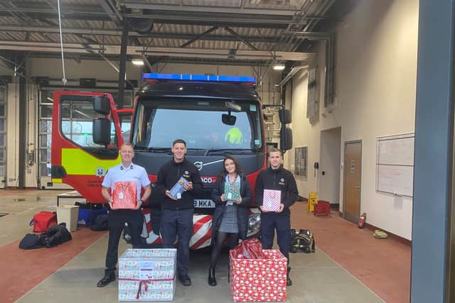 Bea Poole from Home Instead with firefighters in Barnsley.