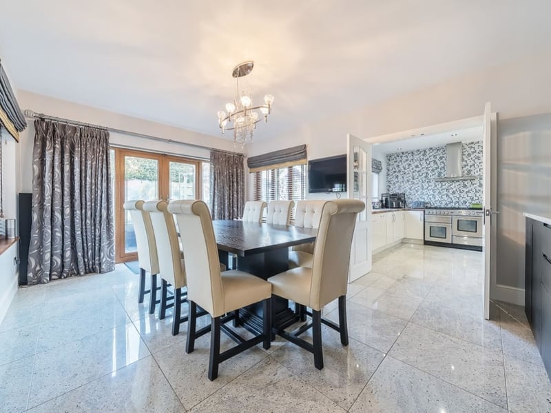The house is just enormous. This dining room is one of 12 rooms (including the double garage and gym) on the ground floor. (Photo courtesy of Zoopla)