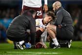 Man City's John Stones receives medical treatment during the match between Everton and Manchester City at Goodison Park, December 27, 2023. (Photo by Paul ELLIS / AFP)
