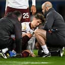 Man City's John Stones receives medical treatment during the match between Everton and Manchester City at Goodison Park, December 27, 2023. (Photo by Paul ELLIS / AFP)