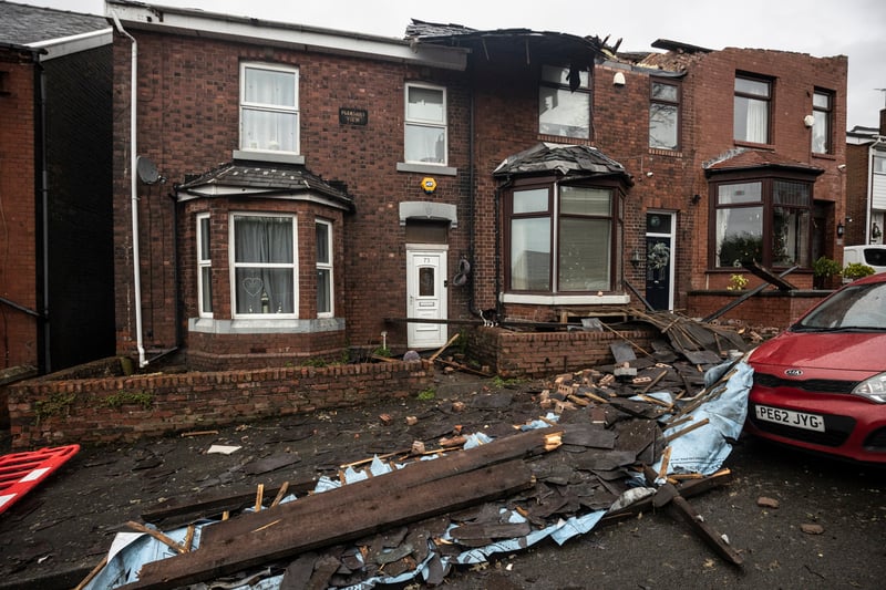 Roofs can be seen ripped off homes on Hough Hill Road. Picture: Ryan Jenkinson/Getty Images