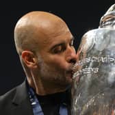 Pep Guardiola, Manager of Manchester City, kisses the UEFA Champions League trophy after the team's victory during the UEFA Champions League 2022/23 final match between FC Internazionale and Manchester City FC at Ataturk Olympic Stadium on June 10, 2023 in Istanbul, Turkey. (Photo by Michael Steele/Getty Images)