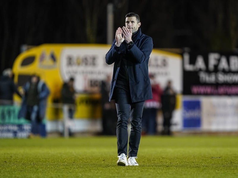 John Mousinho applauds the Pompey fans at the final whistle