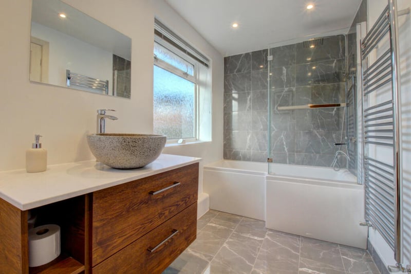 The modern bathroom is to the highest standard of finish, offering both style and functionality.