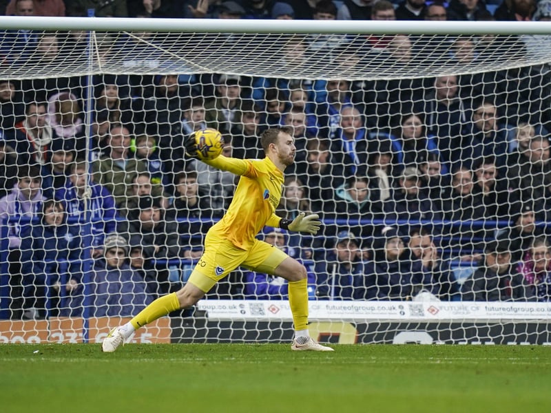 The Pompey fans in the background watch on as Will Norris attempts to set up a Pompey attack.