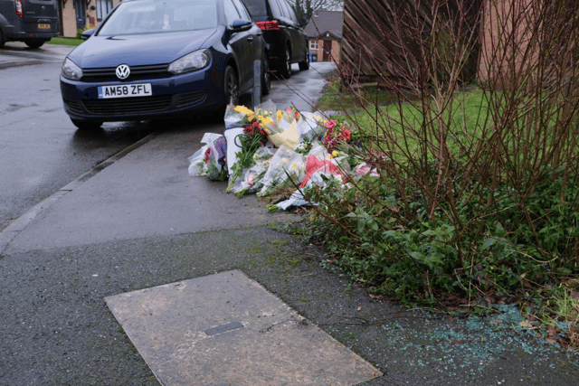 Broken glass and flowers on College Close Burngreave.