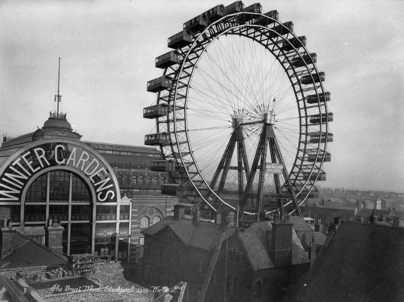 The Great Wheel 1890-1910. A view across the rooftops towards the Great Wheel beside the Winter Gardens in Blackpool. The wheel was erected at the end of the 19th century on the corner of Adelaide Street and Coronation Street