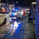 Police and repair workers deal with the aftermath of a crash which wrecked a pedestrian crossing on Ecclesall Road, Sheffield. Picture: David Kessen, National World