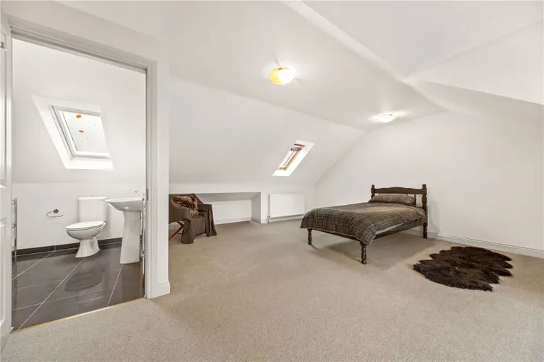 On the second floor is a large guest suite with ensuite.