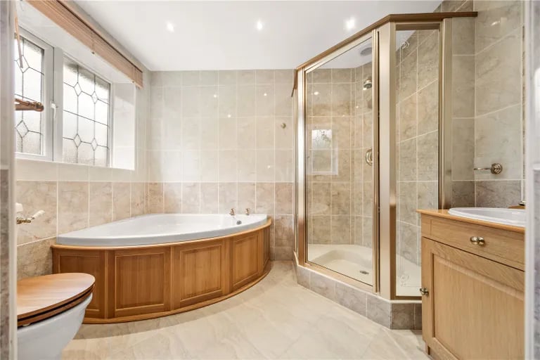 Three of the bedrooms have large ensuites with luxurious baths and showers.