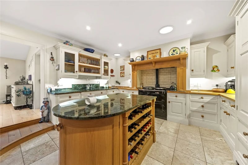 The stunning kitchen with fitted appliances and a central island.