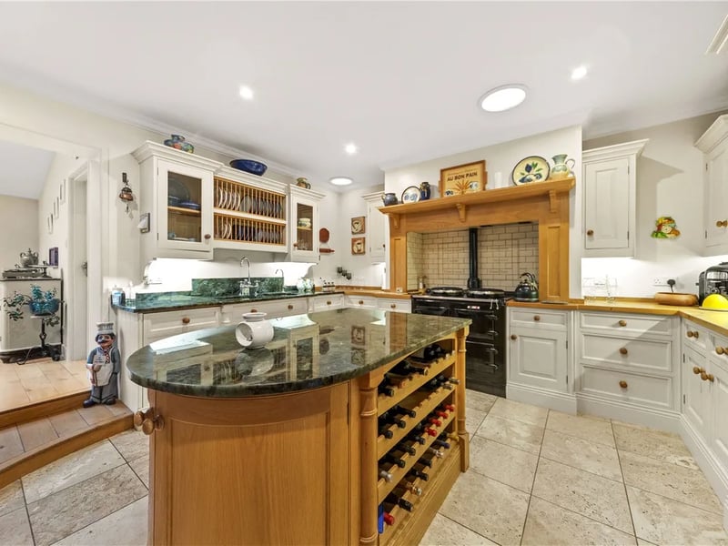 The stunning kitchen with fitted appliances and a central island.