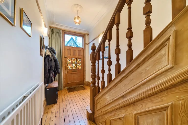 Enter the Victorian home into this large hallway.
